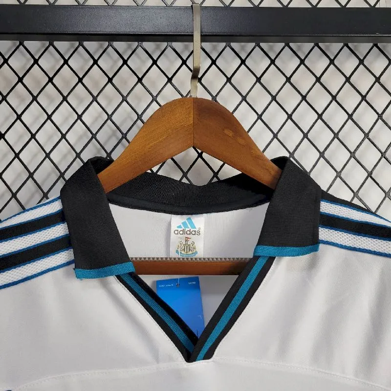 e810793e4ba1afa2e52d51ad401a176a.webp Retro Newcastle United 1999/2000 Away Jersey - Image 8